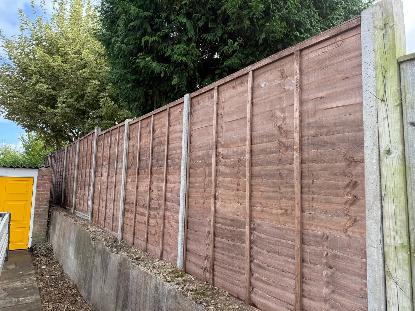 Garden boundary fencing behind a home