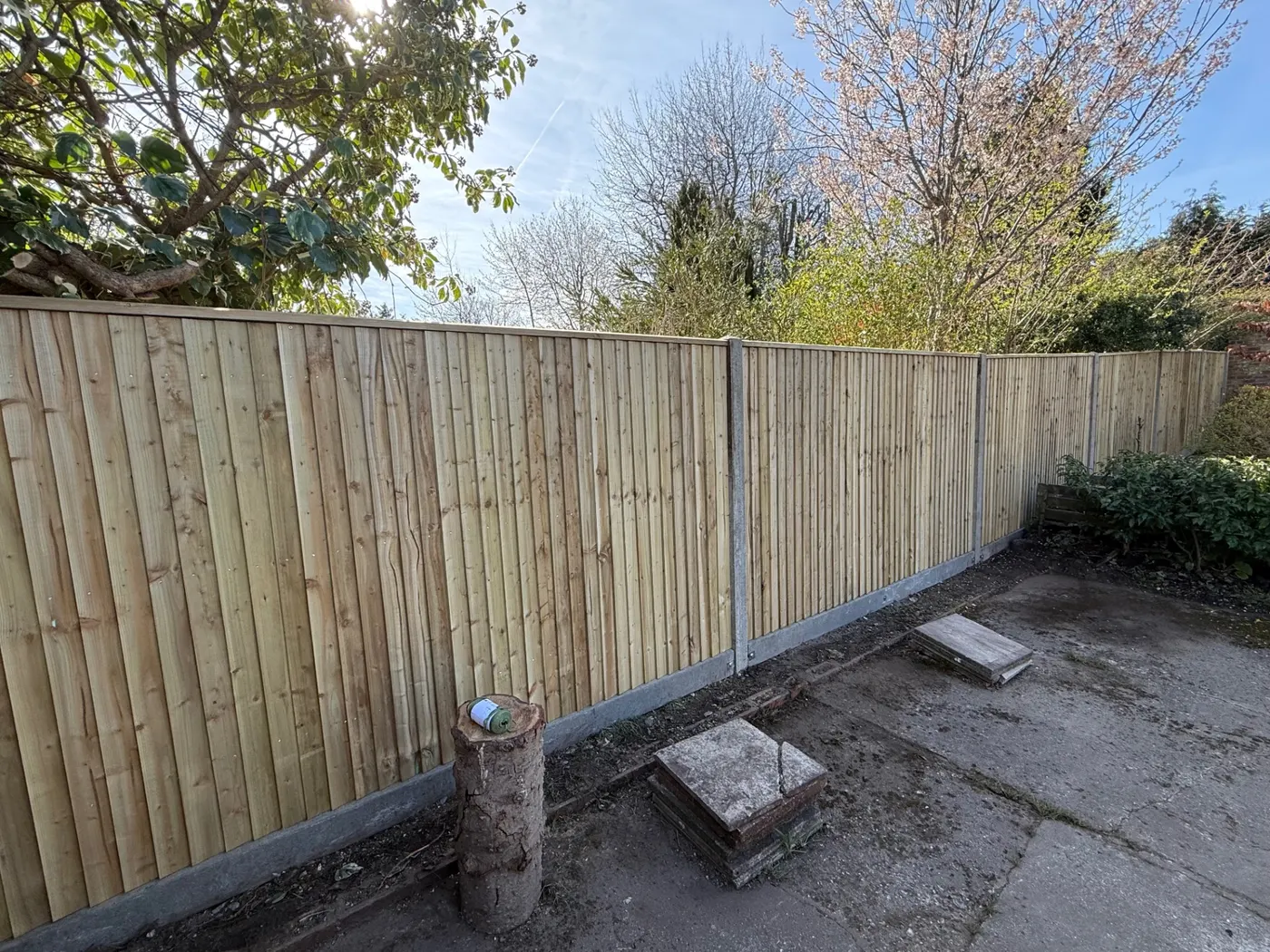 Closeboard fence with concrete posts and gravel boards